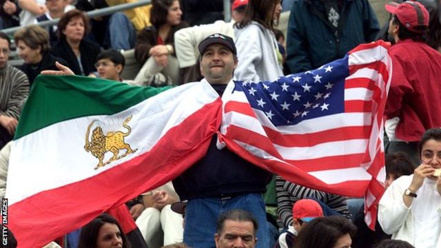 USA vs Iran - Fan holding up both Iranian and United States Flags