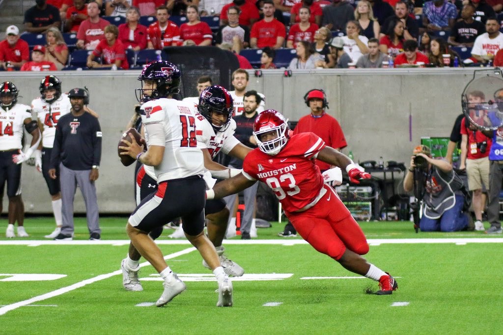 UH defensive lineman Atlias Bell chases down Texas Tech quarterback Tyler Shough during Saturday's game at NRG Stadium. (Courtesy Mario Puente)